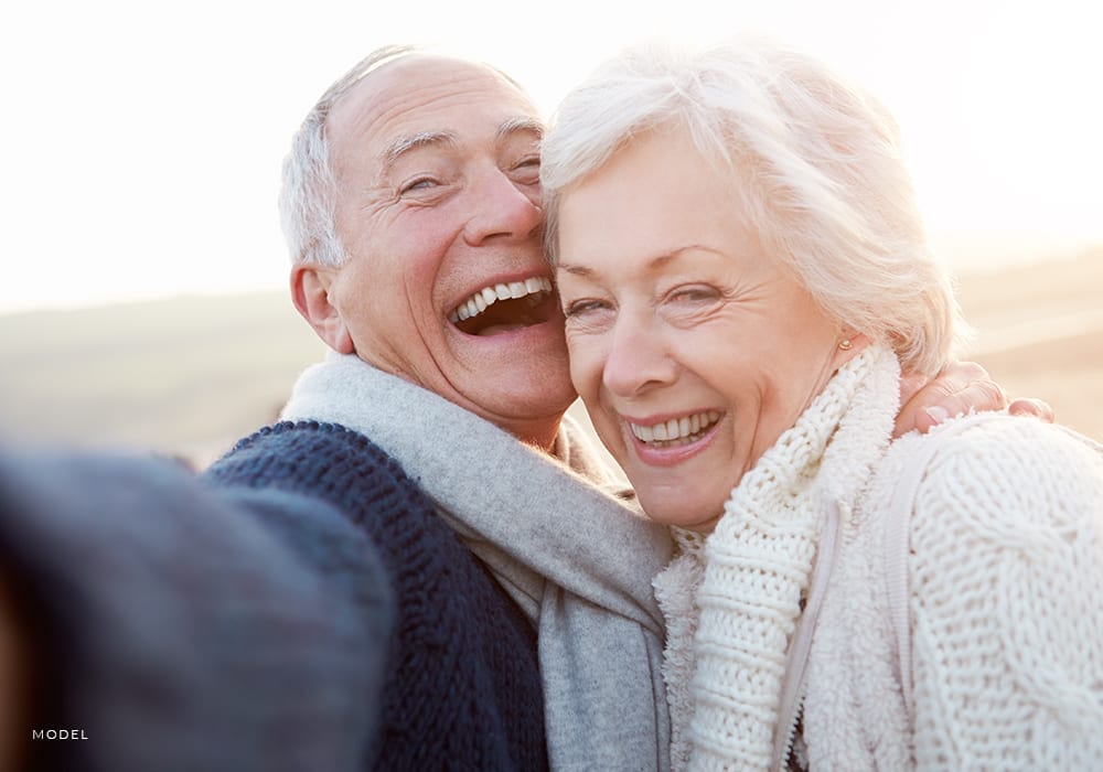 Joyous Elderly Couple Embracing Each Other