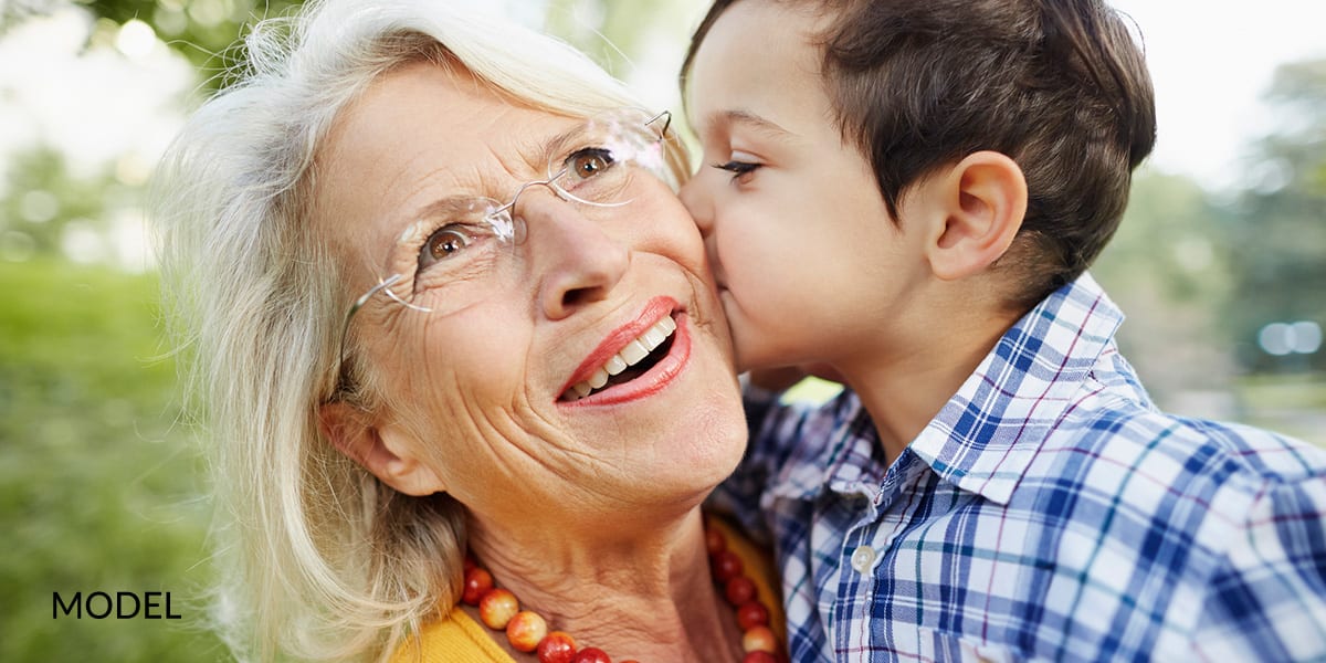 Little Boy Kissing Grandma on the Cheek